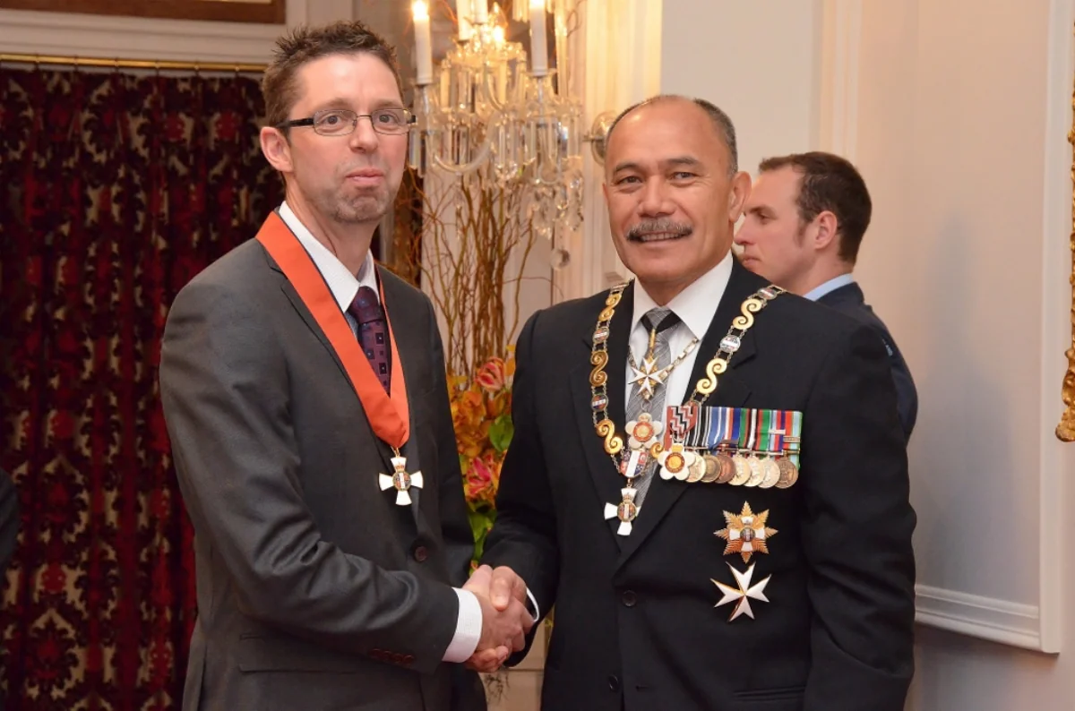 Michael Macknight receiving his Companion of the New Zealand Order of Merit