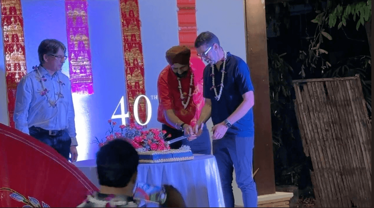 Michael cutting the 40th anniversary cake in Thailand