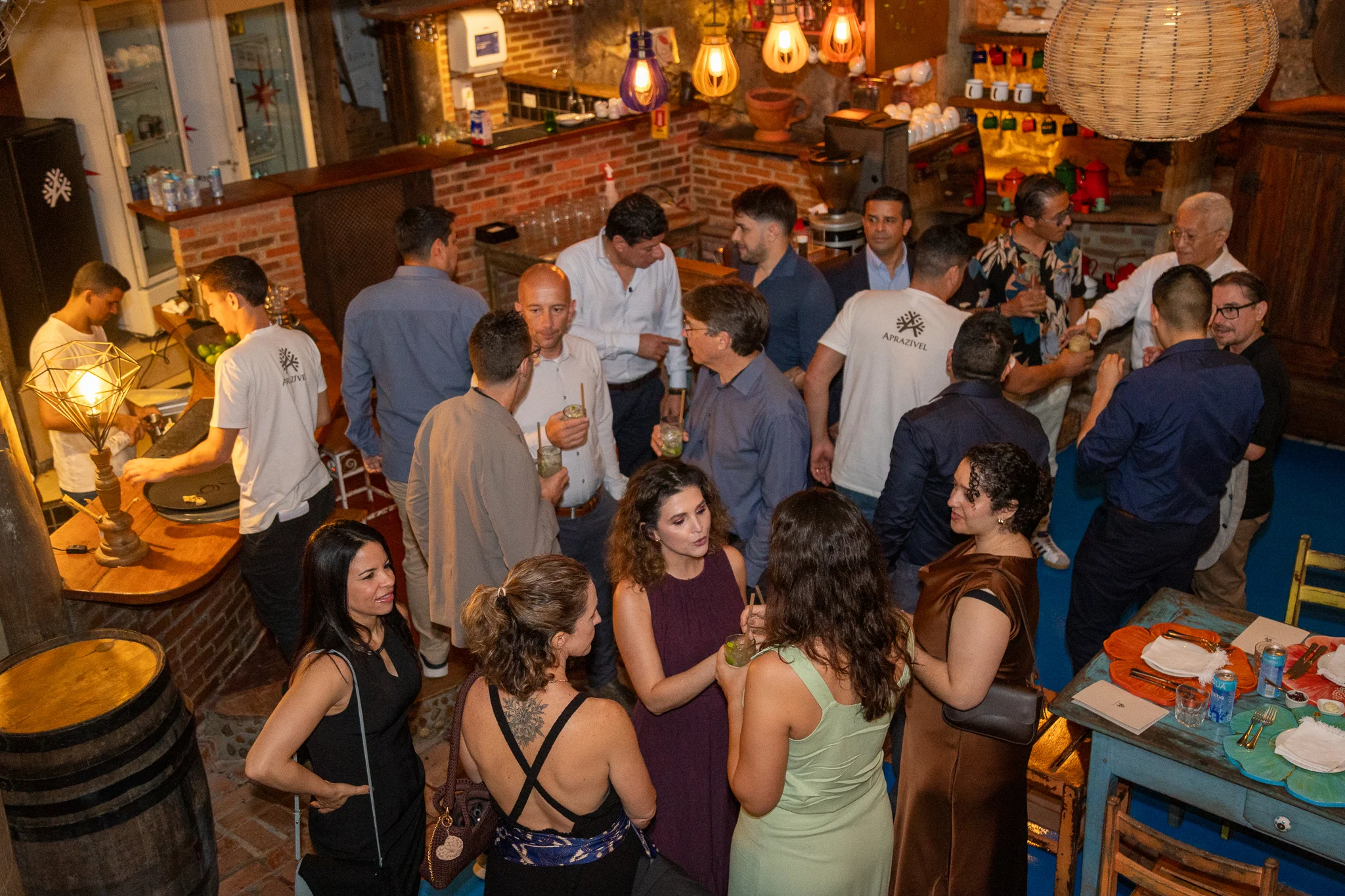 Brazil team mingling at the bar during the 40th anniversary celebration