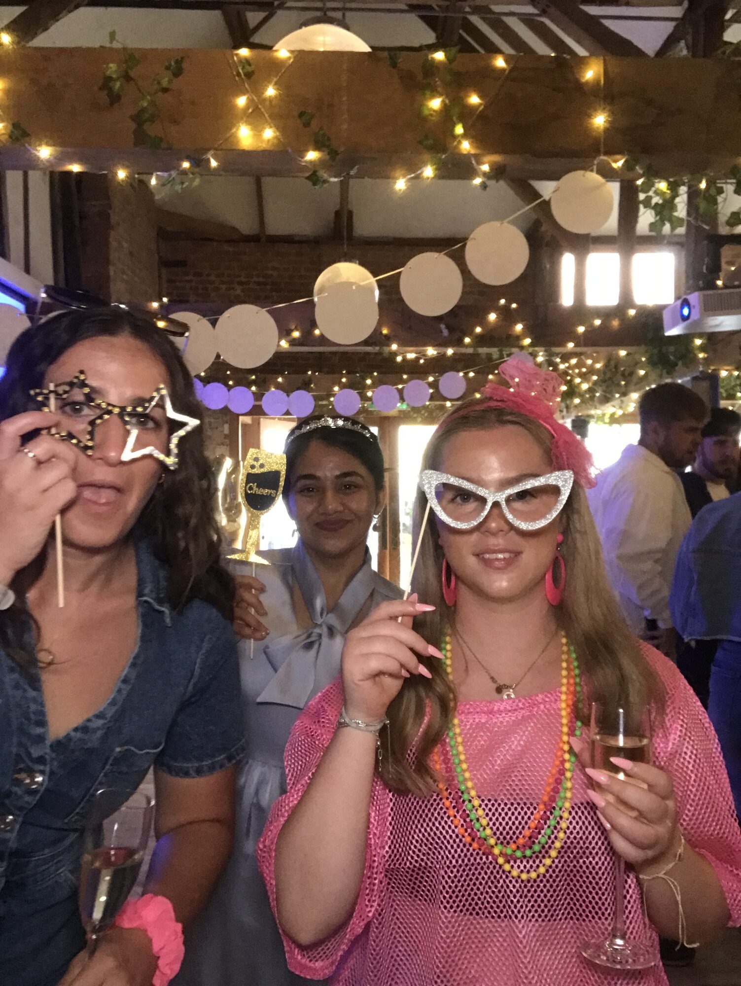 UK team member in the photobooth wearing a pink mesh top