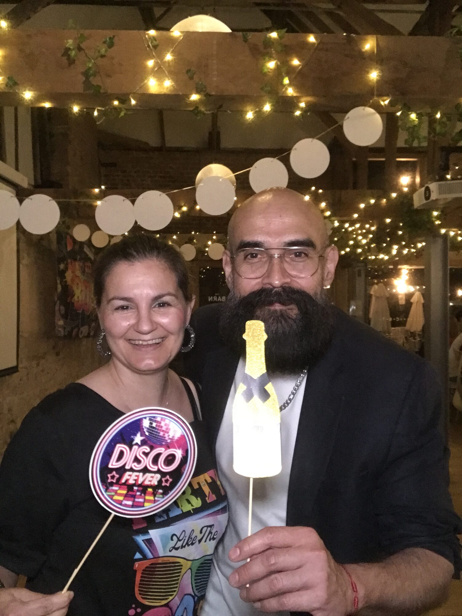 UK team members dressed up for disco fever at the 40th anniversary celebration