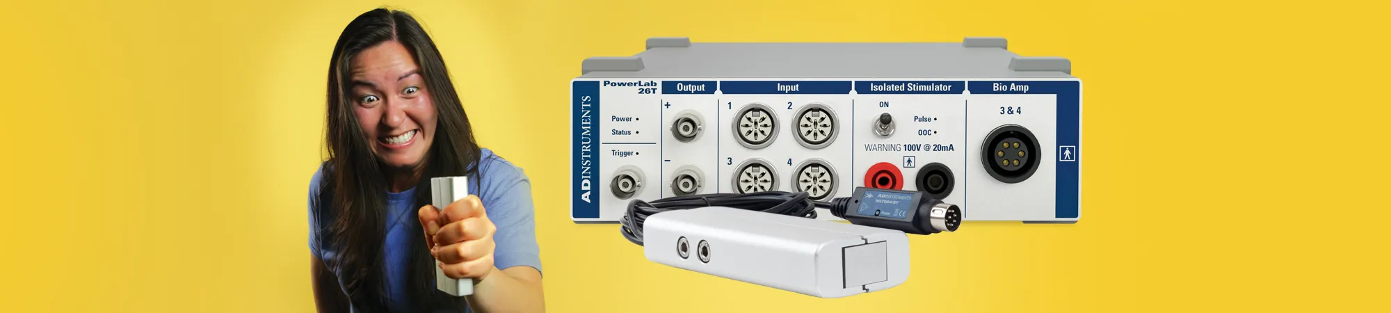 An image of a woman squeezing a grip force transducer. There is also a photo of a PowerLab 26T.