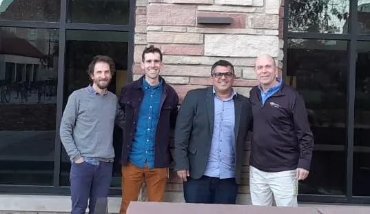 Dr Allen Kluser with three of his research collaborators