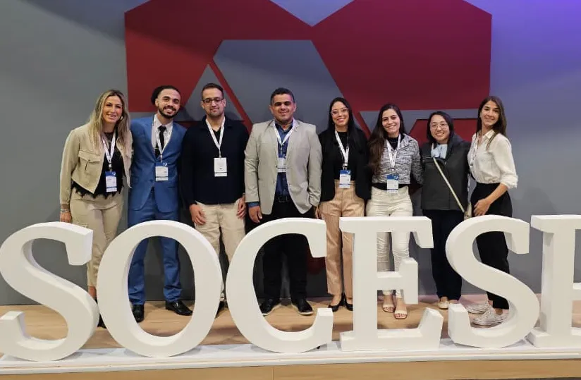 Eight members of the Kluser lab at a conference