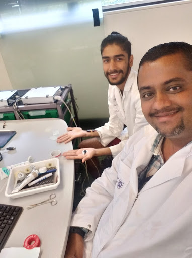 A photo of Dr. Edward Narayan and PhD scholar Harsh Pahuja in the physiology lab at the UQ Gatton campus with a PowerLab setup.