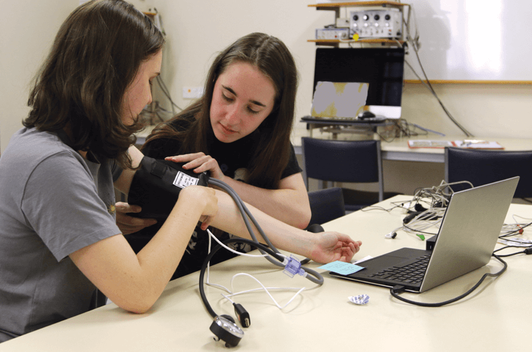 Students using hardware in the lab environment.