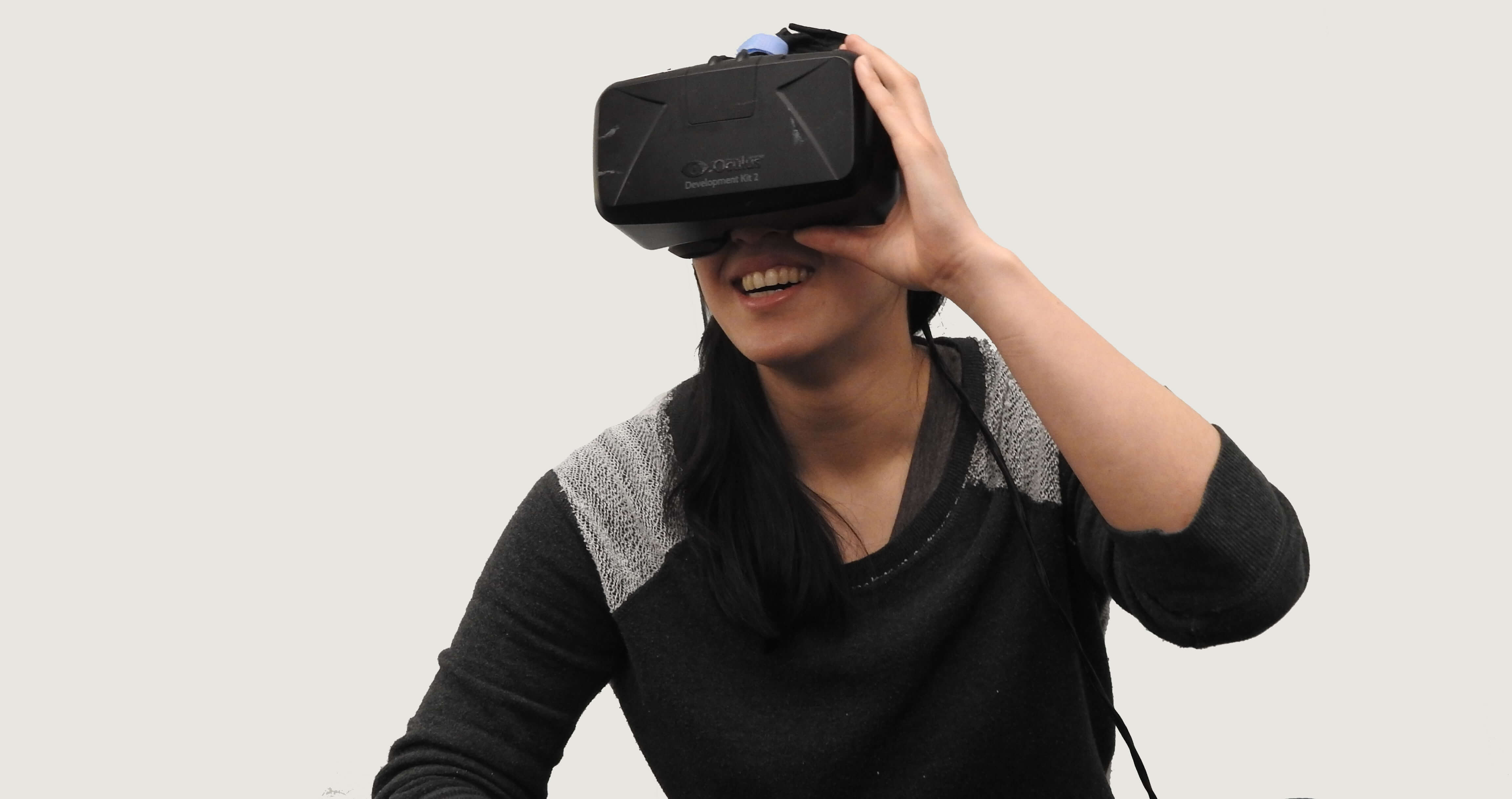 A woman using a virtual reality (VR) headset.